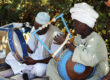 Nubian culture today. Men playing music on traditional instruments.
